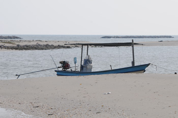 Our boat "moored" on the spit at Laem Pak Bia