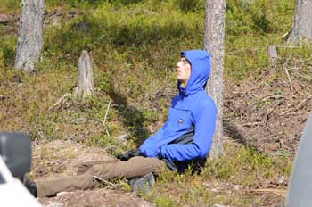 Nick in typical pose waiting for birds and lunch in the forest