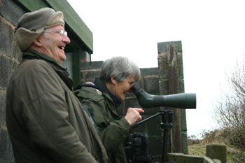Barry and Joyce watching the Otter at Druridge Pools